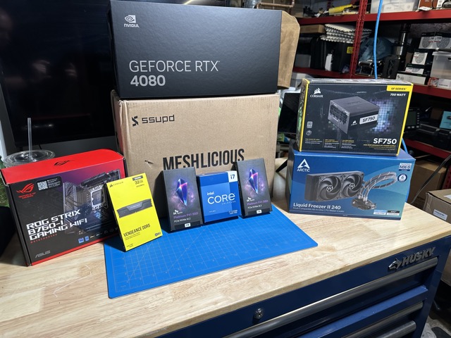 a stack of computer parts on a workbench